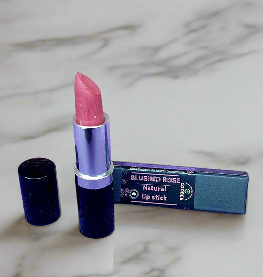 Lipstick with packaging on a purple surface